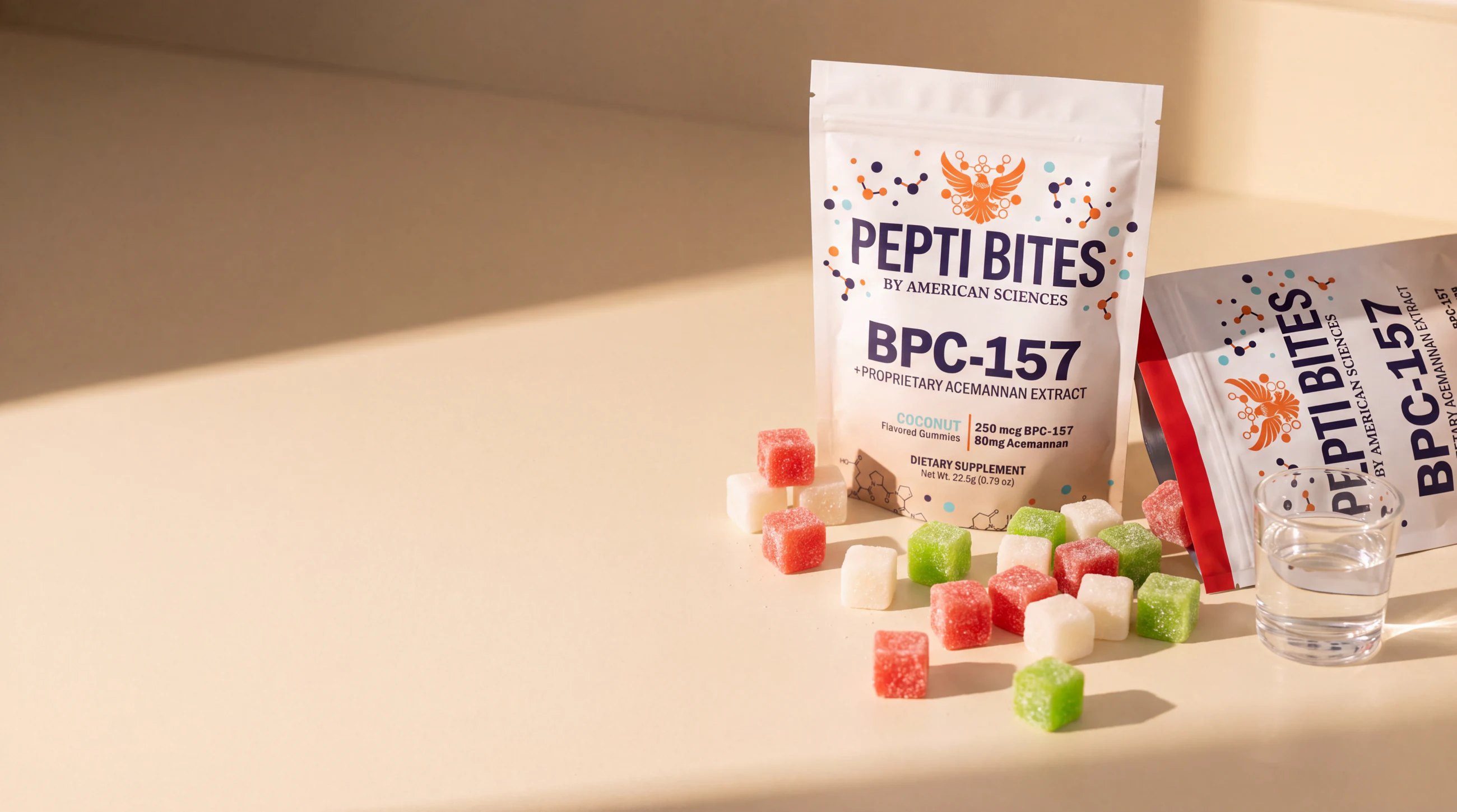 Labelled Pepti Bites pouches with cube gummies on a sunlit cream counter